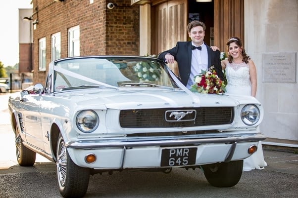 White Ford Mustang Convertible Wedding Car front view with married couple